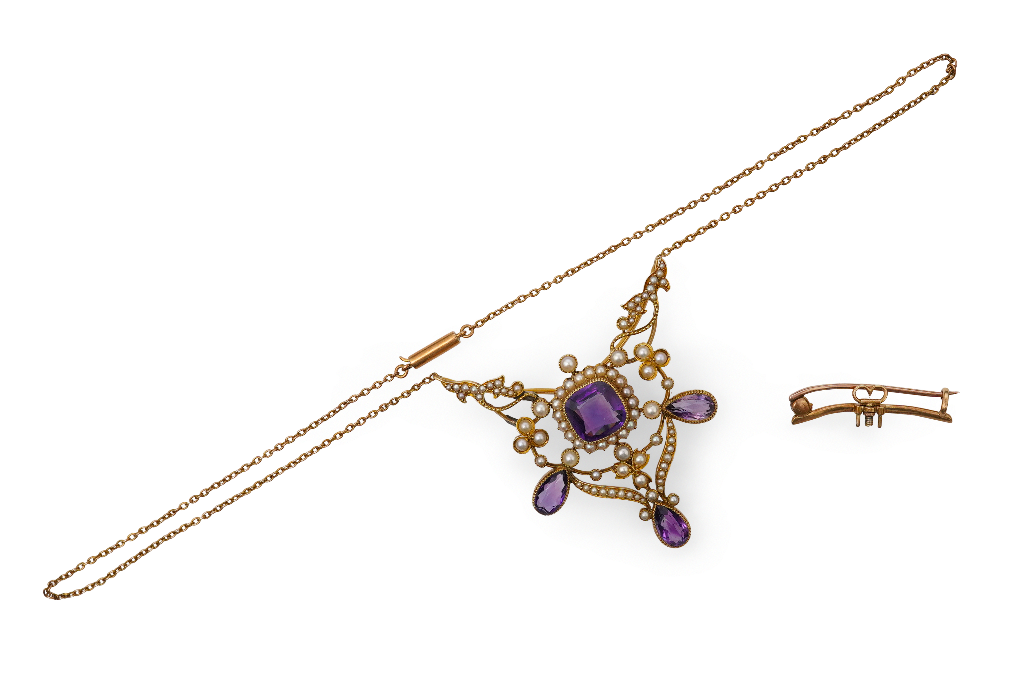 An Edwardian seed pearl and amethyst pendant/brooch, early 20th century